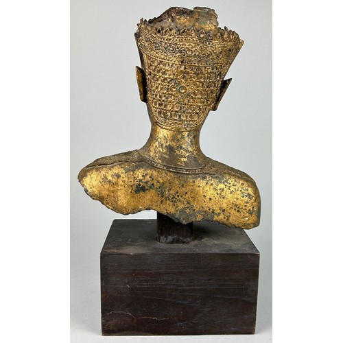 121 - A THAI GILT BRONZE FIGURE OF A MALE HEAD AND UPPER BODY, 

Mounted on a later wooden base. 

The fig... 