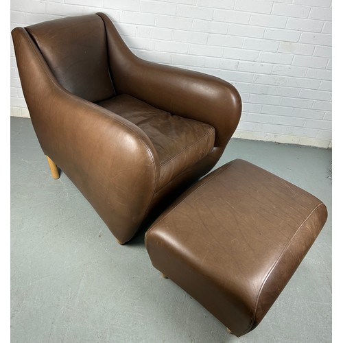 314 - AN SCP BALZAC BROWN LEATHER ARMCHAIR AND FOOTSTOOL BY MATTHEW HILTON, 

Retailed by the Conran Shop....