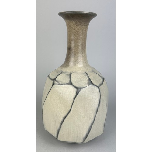 164 - A GLAZED CERAMIC BOTTLE VASE, 

20th Century, marked underneath.

21cm x 11cm