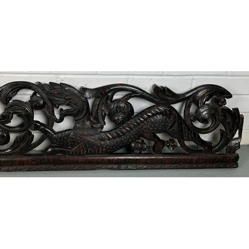 151 - A LARGE CARVED PANEL WITH DRAGONS, POSSIBLY CHINESE ROSEWOOD 19TH CENTURY

158cm x 28cm