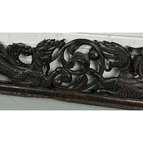 151 - A LARGE CARVED PANEL WITH DRAGONS, POSSIBLY CHINESE ROSEWOOD 19TH CENTURY

158cm x 28cm