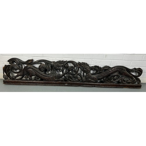 151 - A LARGE CARVED PANEL WITH DRAGONS, POSSIBLY CHINESE ROSEWOOD 19TH CENTURY

158cm x 28cm