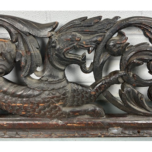 151 - A LARGE CARVED PANEL WITH DRAGONS, POSSIBLY CHINESE ROSEWOOD 19TH CENTURY

158cm x 28cm