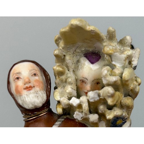 173 - A MEISSEN PORCELAIN DOUBLE SCENT BOTTLE WITH STOPPERS IN THE FORM OF MONK CONCEALING A WOMAN IN A BU... 