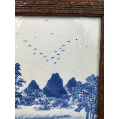 145 - A CHINESE 19TH CENTURY  BLUE AND WHITE PAINTED PORCELAIN PANEL DEPICTING FU LU SHOU BESIDE A RIVER W... 