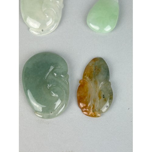 100A - A GROUP OF CHINESE JADE STONES DEPICTING FRUIT, LOTUS AND OTHERS (9)