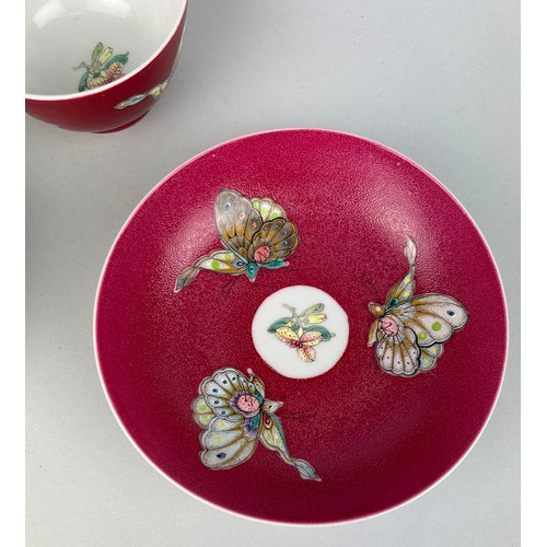 144 - A CHINESE TEA CUP AND TWO SAUCERS (3)