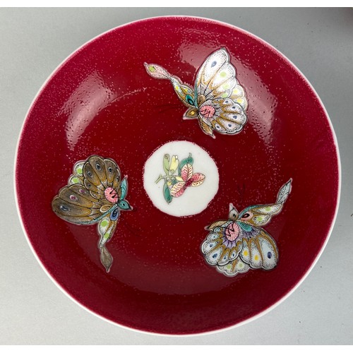 144 - A CHINESE TEA CUP AND TWO SAUCERS (3)