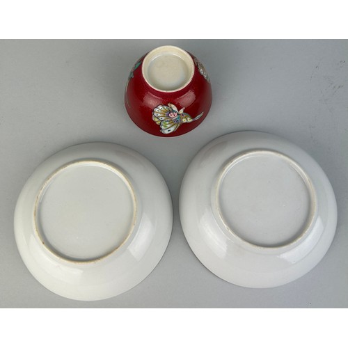 144 - A CHINESE TEA CUP AND TWO SAUCERS (3)