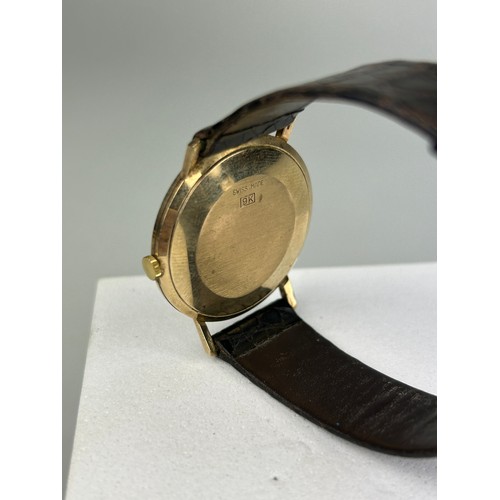 71 - A MANIS 17 JEWELS WRISTWATCH SWISS MADE MARKED 9K, 

With brown leather strap.