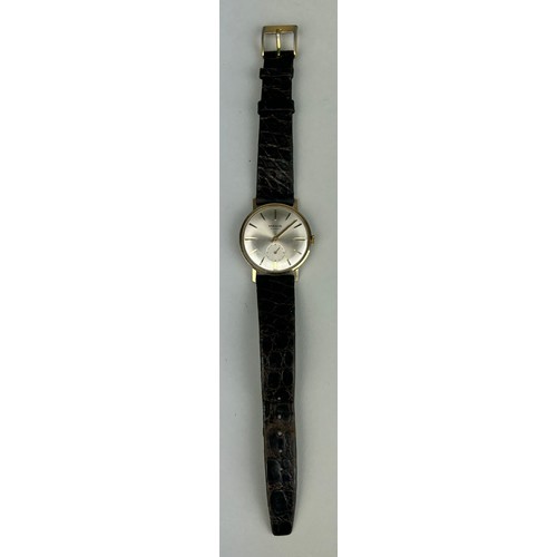 71 - A MANIS 17 JEWELS WRISTWATCH SWISS MADE MARKED 9K, 

With brown leather strap.