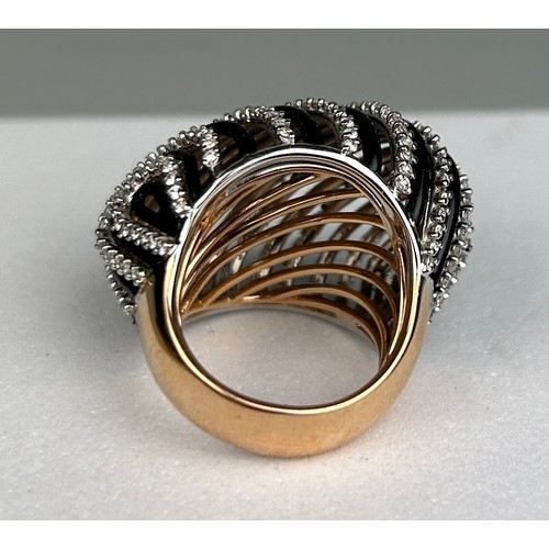 78 - AN 18CT GOLD DECO DESIGN RING SET WITH DIAMONDS AND BLACK ENAMEL, 20.8 grams

Ring size 12.