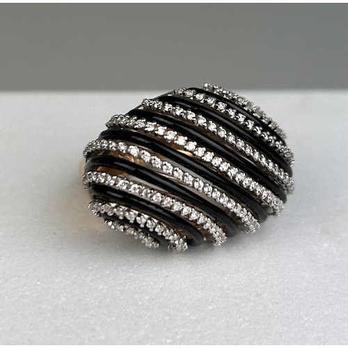 78 - AN 18CT GOLD DECO DESIGN RING SET WITH DIAMONDS AND BLACK ENAMEL, 20.8 grams

Ring size 12.