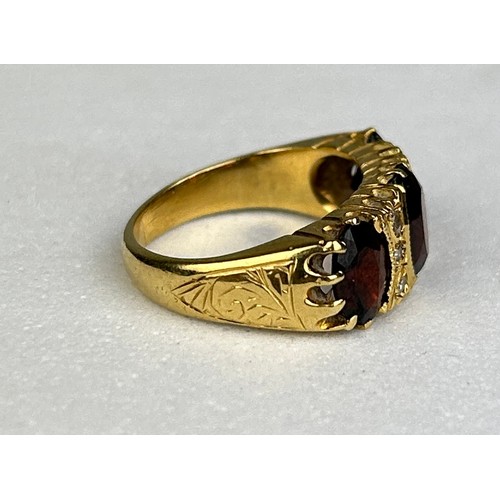 82 - AN ANTIQUE 18CT GOLD RING SET WITH THREE GARNETS, 

Weight: 6.69 gms

Ring size 12.