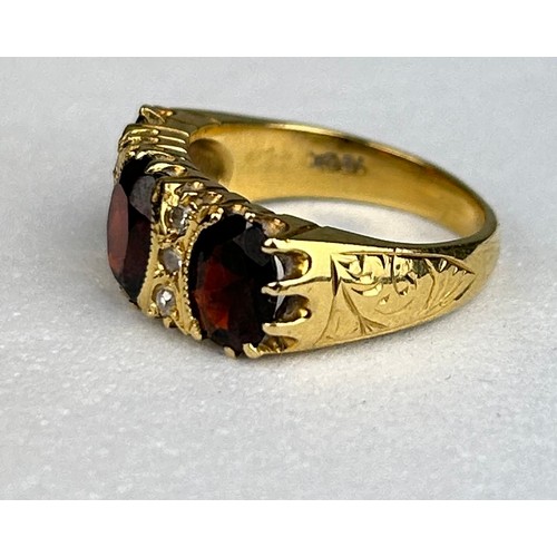 82 - AN ANTIQUE 18CT GOLD RING SET WITH THREE GARNETS, 

Weight: 6.69 gms

Ring size 12.