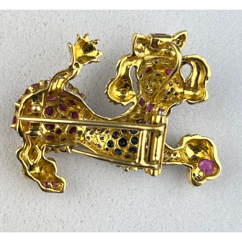 89 - AN 18CT GOLD BROOCH IN THE FORM OF A POODLE DOG SET WITH RUBIES AND SAPPHIRES,

15.37gms