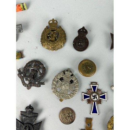 105 - A COLLECTION OF WARTIME BADGES AND MEDALS, 

To include one 1938 German Mothers medal, automobillia ... 