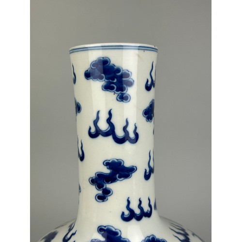 137 - A LARGE CHINESE BLUE AND WHITE VASE OF GLOBULAR DECORATED WITH DRAGONS, 

40cm x 20cm