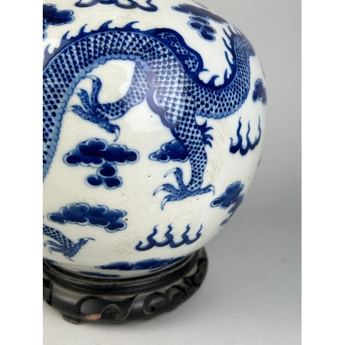 137 - A LARGE CHINESE BLUE AND WHITE VASE OF GLOBULAR DECORATED WITH DRAGONS, 

40cm x 20cm