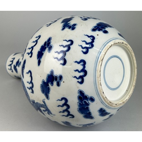 137 - A LARGE CHINESE BLUE AND WHITE VASE OF GLOBULAR DECORATED WITH DRAGONS, 

40cm x 20cm