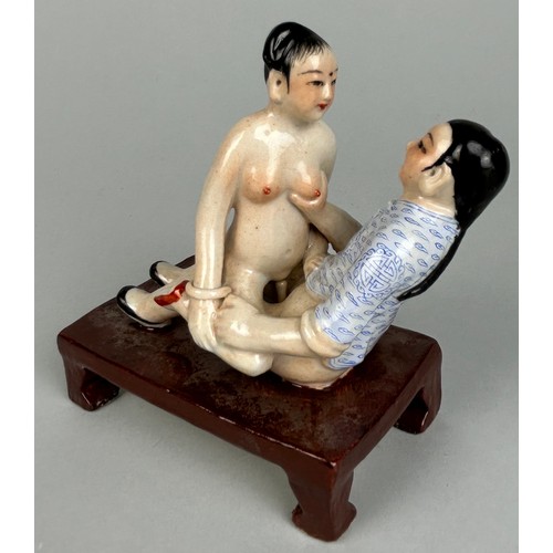 113 - A CHINESE EROTIC CERAMIC GROUP DEPICTING MALE AND FEMALE FIGURES,

12cm x 10cm x 6cm