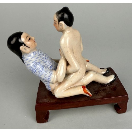 113 - A CHINESE EROTIC CERAMIC GROUP DEPICTING MALE AND FEMALE FIGURES,

12cm x 10cm x 6cm