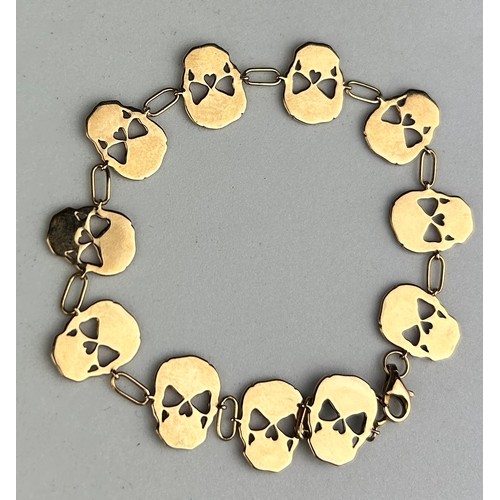 95 - A GOLD SKULL BRACELET WITH WITH BLACK DIAMONDS, 

12.2gms