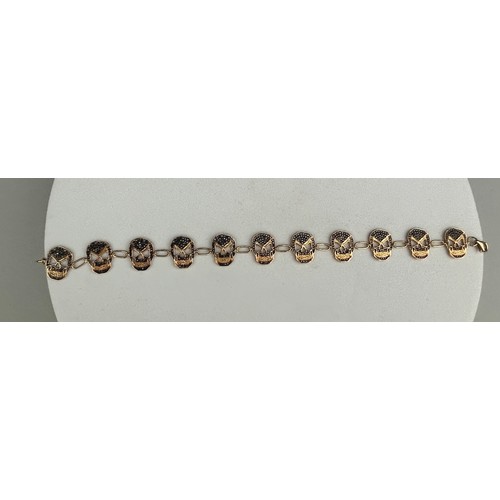 95 - A GOLD SKULL BRACELET WITH WITH BLACK DIAMONDS, 

12.2gms