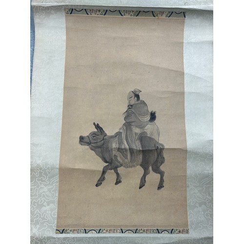 153 - A CHINESE SCROLL PAINTED WITH A MAN RIDING A MULE, 

228cm L x 46cm W