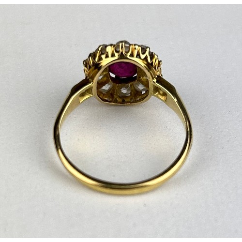 76 - AN 18CT GOLD RING WITH CLAW SET RUBY SURROUNDED BY 14 DIAMONDS,

Weight: 4.1gms 

Ring size 17.