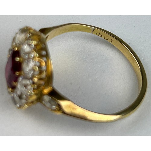 76 - AN 18CT GOLD RING WITH CLAW SET RUBY SURROUNDED BY 14 DIAMONDS,

Weight: 4.1gms 

Ring size 17.