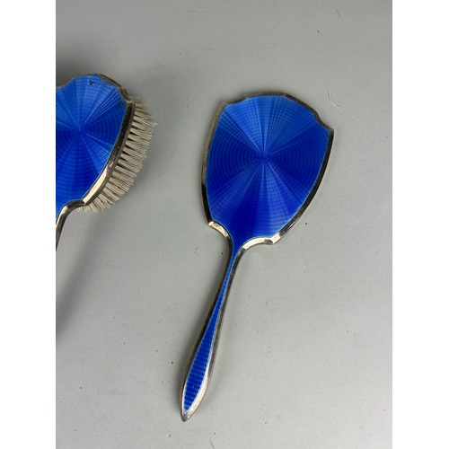 110 - A MAPPIN AND WEBB SILVER AND BLUE GUILLOCHE ENAMEL PART VANITY SET (5), 

And an unrelated pair of s... 