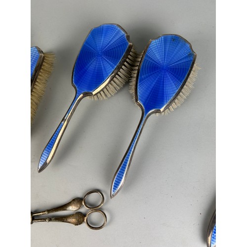 110 - A MAPPIN AND WEBB SILVER AND BLUE GUILLOCHE ENAMEL PART VANITY SET (5), 

And an unrelated pair of s... 