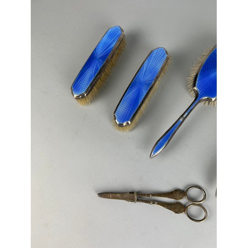 110 - A MAPPIN AND WEBB SILVER AND BLUE GUILLOCHE ENAMEL PART VANITY SET (5), 

And an unrelated pair of s... 