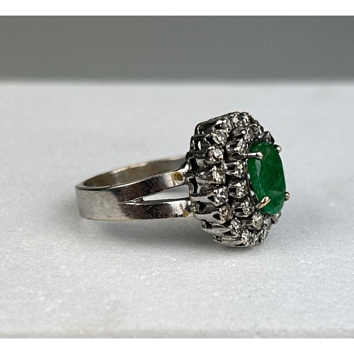 79 - AN 18CT WHITE GOLD RING SET WITH DIAMONDS AND EMERALDS,

Weight: 6.1gms

Ring size 11.