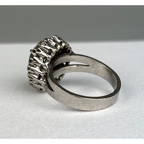 79 - AN 18CT WHITE GOLD RING SET WITH DIAMONDS AND EMERALDS,

Weight: 6.1gms

Ring size 11.