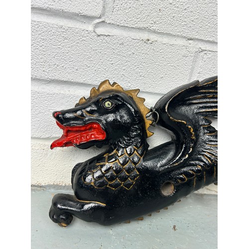 152 - A CHINESE WALL HANGING BLACK PAINTED METAL DRAGON,

90cm x 17cm