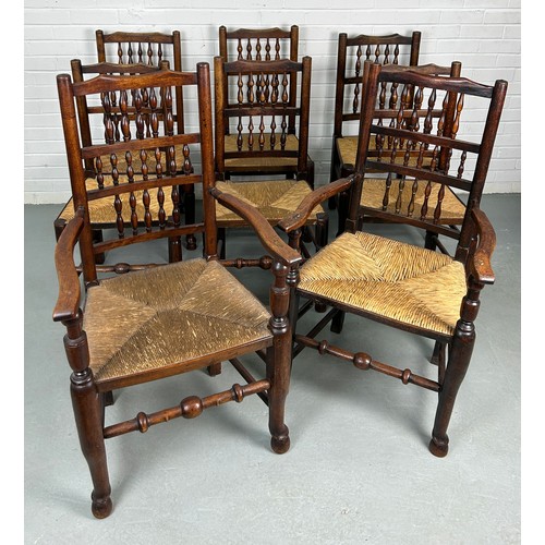 499 - A SET OF EIGHT COUNTRY HOUSE BOBBIN SPINDLE BACK CHAIRS WITH RUSH SEATS PROBABLY NORTH COUNTRY, 

La... 