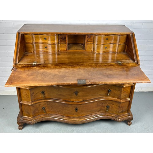 506 - A CONTINENTAL WALNUT SERPENTINE BUREAU, 

116cm x 108cm x 58cm 
Early 20th century, with fall front ... 