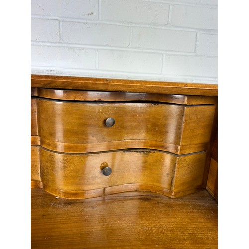 506 - A CONTINENTAL WALNUT SERPENTINE BUREAU, 

116cm x 108cm x 58cm 
Early 20th century, with fall front ... 