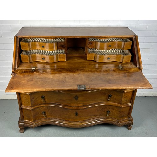 506 - A CONTINENTAL WALNUT SERPENTINE BUREAU, 

116cm x 108cm x 58cm 
Early 20th century, with fall front ... 