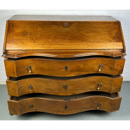 506 - A CONTINENTAL WALNUT SERPENTINE BUREAU, 

116cm x 108cm x 58cm 
Early 20th century, with fall front ... 