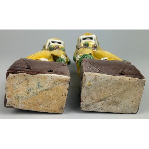 110A - A PAIR OF SANCAI GLAZED FOO DOGS, 

25cm x 9cm