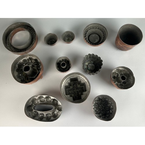 352 - A LARGE COLLECTION OF VICTORIAN JELLY MOULDS OF VARIOUS SHAPES AND SIZES (12) 

One marked 'Register... 