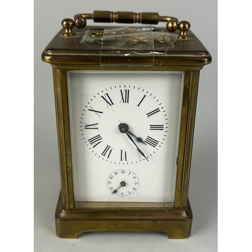 344 - A FRENCH BRASS CARRIAGE CLOCK,

10cm x 6cm 
One glass side missing.