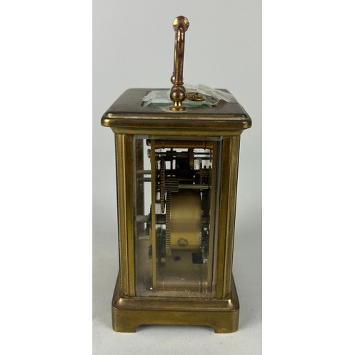 344 - A FRENCH BRASS CARRIAGE CLOCK,

10cm x 6cm 
One glass side missing.