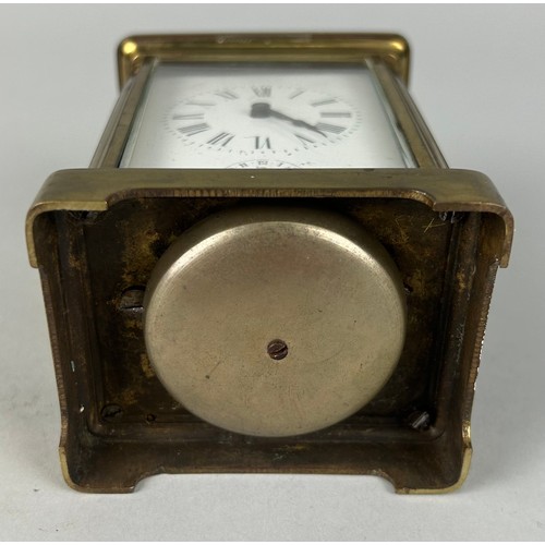 344 - A FRENCH BRASS CARRIAGE CLOCK,

10cm x 6cm 
One glass side missing.