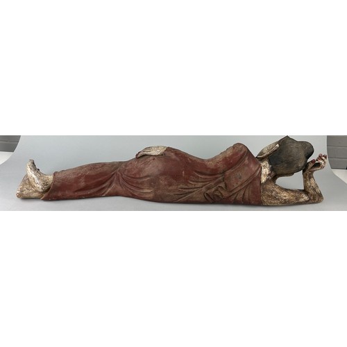 88 - A THAI CARVED WOODEN SCULPTURE OF THE RECLINING BUDDHA, 

20th Century

105cm x 23cm