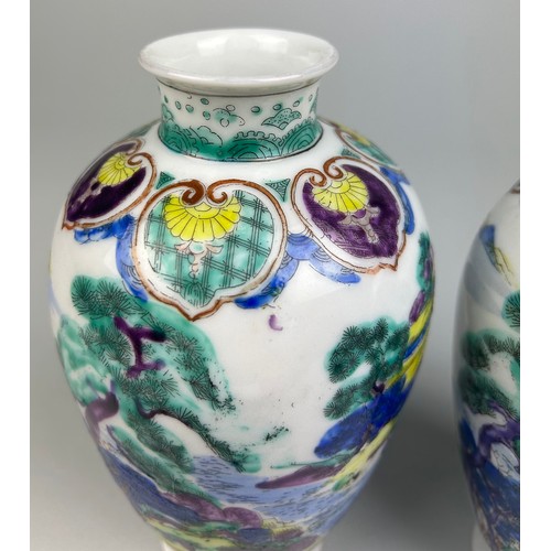 79 - A PAIR OF CHINESE VASES DECORATED WITH FIGURES AND LANDSCAPE SCENES, 

18cm x 9cm each.