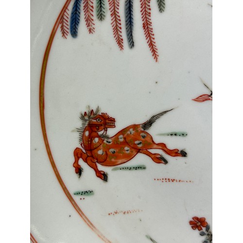 81 - A 19TH CENTURY CHINESE PLATE DECORATED WITH A HORSE AND FLOWERS, 

22cm diameter.